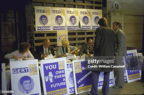 During local elections, voters register with KP-Conservative Party, with campaign posters touting candidates Gert Parsons.