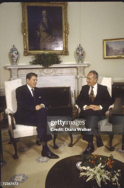 President Ronald Reagan with Israeli PM Shimon Peres in Oval Office.