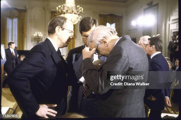 Rep. Les Aspin confers with WH aid Dennis Thames and Rep Trent Lott during WH mtg on MX.