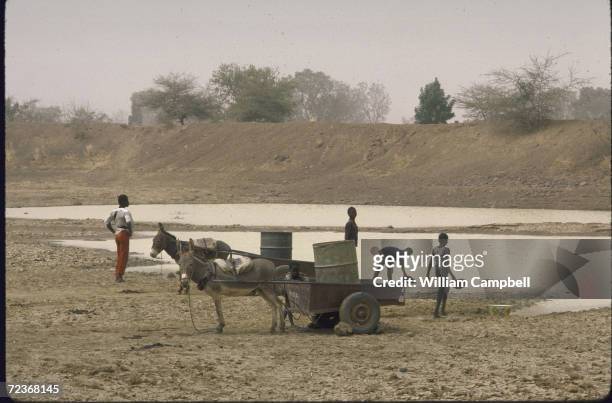 Villagers gathering water.