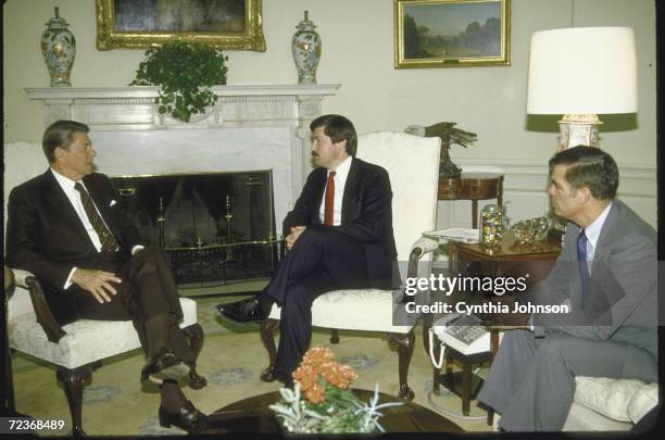 President Ronald Reagan meeting. With Iowa Governor Terry Branstad & Agri. Secretary John Block, prob. Re aid to farmers, in Oval Office.