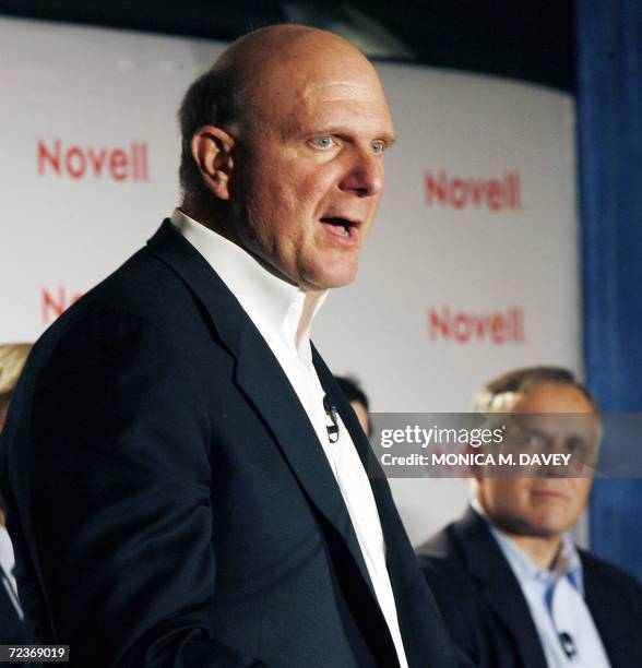 Of Microsoft, Steve Ballmer speaks during a press conference as President and CEO of Novell Inc., Ron Hovsepian listens during a press conference in...