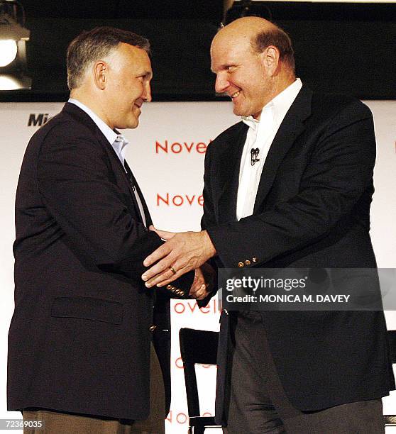 San Francisco, UNITED STATES: President and CEO of Novell Inc., Ron Hovsepian and CEO of Microsoft, Steve Ballmer shake hands during a press...