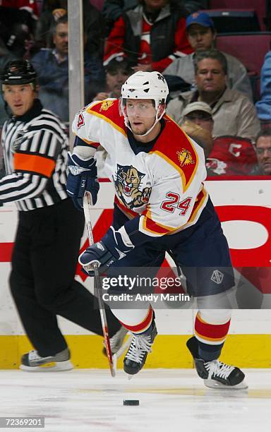 Ruslan Salei of the Florida Panthers skates with the puck against the New Jersey Devils at Continental Airlines Arena on October 26, 2006 in East...