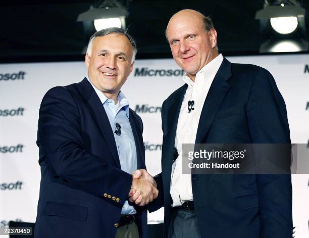 In this photo provided by Microsoft, CEO Steve Ballmer and Novell President and CEO Ron Hovsepian greet each other before a press event to announce a...