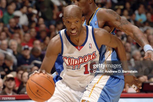 Sam Cassell of the Los Angeles Clippers makes a move to the basket against J.R. Smith of the Denver Nuggets November 2, 2006 at Staples Center in Los...