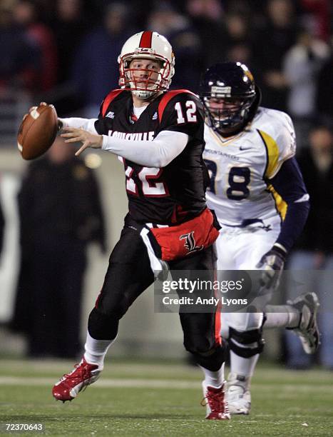 Brian Brohm of the Louisville Cardinals looks to pass against Pat Liebig of the West Virginia Mountaineers November 2, 20006 at Papa John's Cardinal...