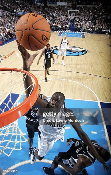 DeSagana Diop of the Dallas Mavericks shoots the ball over Michael Finley of the San Antonio Spurs on November 2, 2006 at the American Airlines...