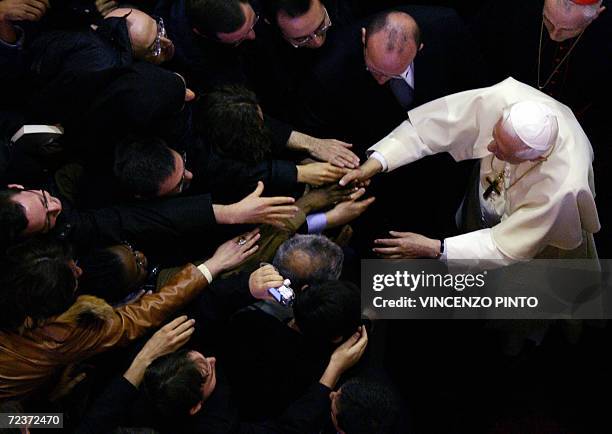 Pope Benedict XVI salutes students and teachers as he visit the Pontifical Gregorian University in Rome 03 November 2006. The Vatican and Ankara both...