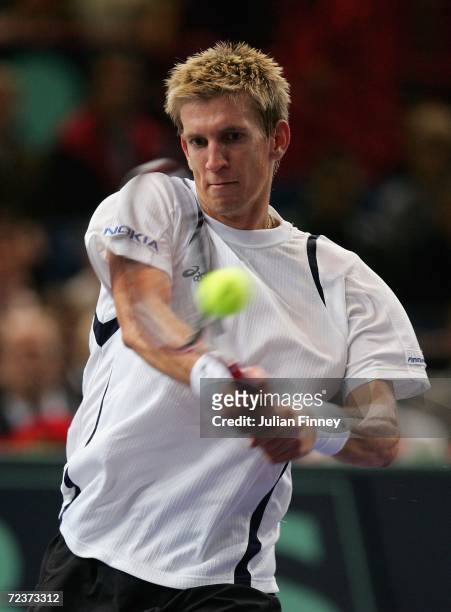 Jarkko Nieminen of Finland plays a backhand in his match against Tommy Robredo of Spain in the quarter finals during day five of the BNP Paribas ATP...