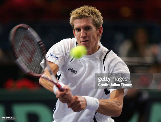 Jarkko Nieminen of Finland plays a backhand in his match against Tommy Robredo of Spain in the quarter finals during day five of the BNP Paribas ATP...