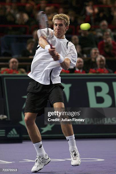 Jarkko Nieminen of Finland plays a backhand in his match against Tommy Robredo of Spain in the quarter finals during day five of the BNP Paribas ATP...