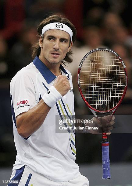 Tommy Robredo of Spain celebrates winning a point in his match against Jarkko Nieminen of Finland in the quarter finals during day five of the BNP...