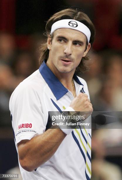 Tommy Robredo of Spain celebrates winning a point in his match against Jarkko Nieminen of Finland in the quarter finals during day five of the BNP...