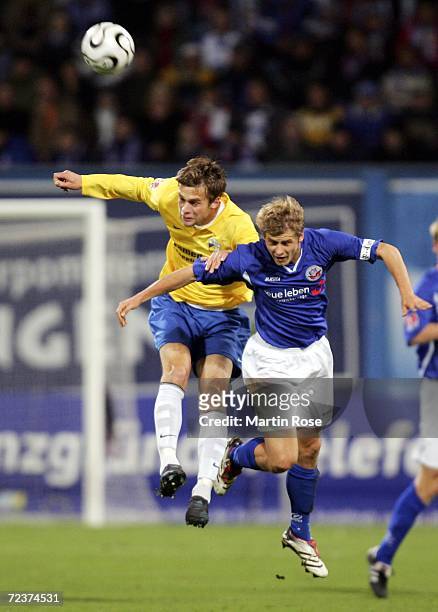 Sven Guenther of Jena and Marc Stein of Rostock jump to head the ball during the Second Bundesliga match between Hansa Rostock and Carl Zeiss Jena at...