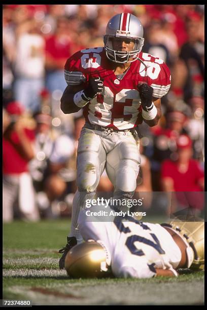 Terry Glenn of the Ohio State Buckeyes stands over Shawn Wooden of the Notre Dame Fighting Irish during a game at Ohio Stadium in Columbus, Ohio....