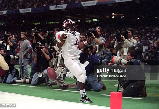 Andre Kendrick of the Virginia Tech Hokies makes a touchdown during the Nokita Sugar Bowl Game against the Florida State Seminoles at the Louisiana...