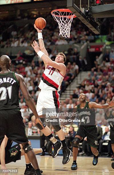 Arvydas Sabonis of the Portland Trailblazers makes a layup during the NBA Western Conference Playoffs Round One Game against the Minnesota...