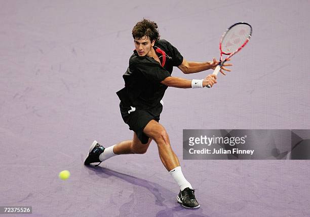 Mario Ancic of Croatia plays a backhand in his match against Nikolay Davydenko of Russia in the quarter finals during day five of the BNP Paribas ATP...