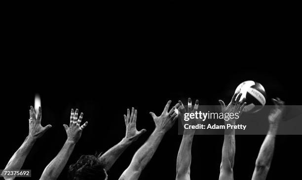 Team Brazil blocks a spike from Italy during the men's indoor Volleyball gold medal match on August 29, 2004 during the Athens 2004 Summer Olympic...