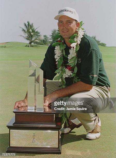 Tom Lehman poses with the trophy after winning the 1996 Mastercard PGA Grand Slam at the Poipu Bay Resort Golf Course in Poipu, Kauai, Hawaii. Lehman...