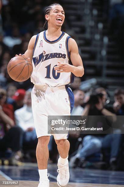 Point guard Tyronn Lue of the Washington Wizards dribbles the ball during the NBA game against the Miami Heat at the MCI Center in Washington, D.C....