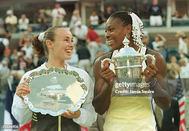 Matina Hingis of Switzerland and Serena Williams exchange glances during the trophy presentation after the singles final during the semifinals of the...