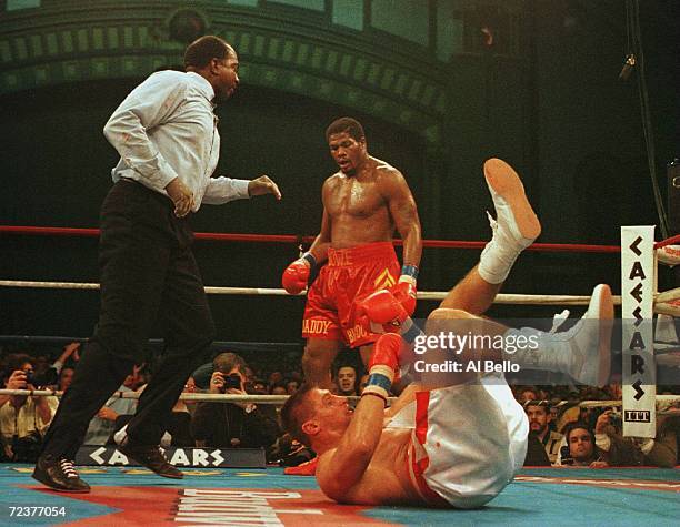 Andrew Golota is knocked down by Riddick Bowe during their return bout at the Atlantic City Convention Center in Atlantic City, New Jersey.