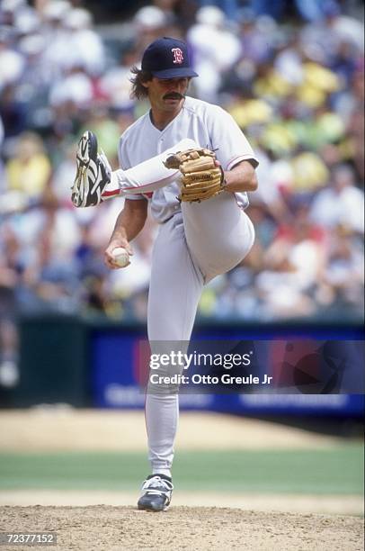 Pitcher Dennis Eckersley of the Boston Red Sox winds up for the pitch during a game against the Oakland Athletics at the Oakland Coliseum in Oakland,...