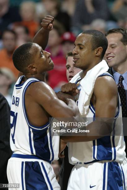 Jason Williams and Chris Duhon of Duke celebrate their win over Wake Forest in the ACC Tournament game at the Charlotte Coliseum in Charlotte, North...
