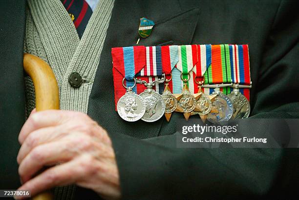 An old soldier proudly shows of his campaign medals May 28, 2004 in Edinburgh, Scotland. Old soldiers of the Normandy Veterans Association gathered...