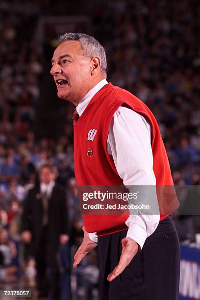 Head coach Dick Bennett of Wisconsin shouts out instructions to his team during the semifinal round of the NCAA Final Four against Michigan State at...