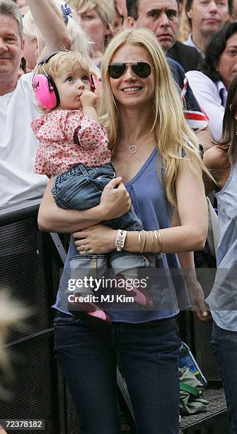 Actress Gwyneth Paltrow and daughter Apple watch Coldplay singer Chris Martin perform on stage at "Live 8 London" in Hyde Park on July 2, 2005 in...