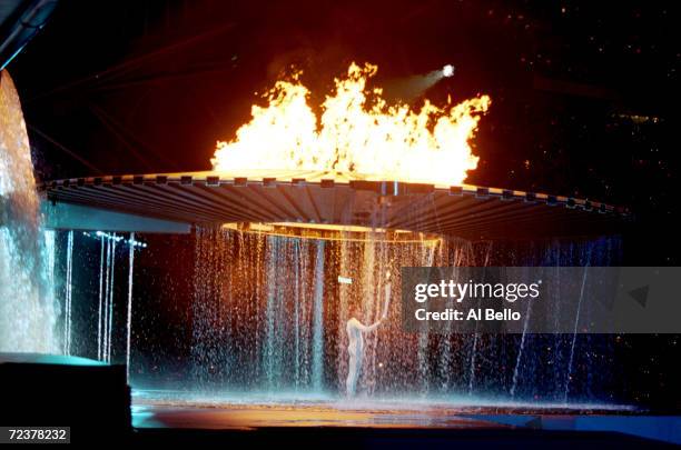 Cathy Freeman of Australia lights the Olympic Flame during the Opening Ceremony of the Sydney 2000 Olympic Games at the Olympic Stadium in Homebush...