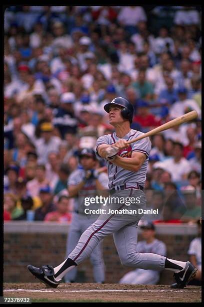 Outfielder Dale Murphy of the Atlanta Braves swings at a pitch during a game against the Chicago Cubs at Wrigley Field in Chicago, Illinois.