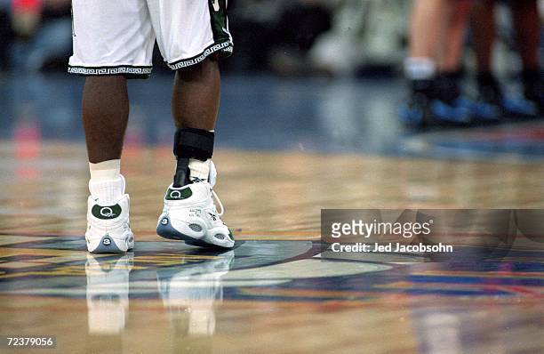 Mateen Cleaves of the Michigan State Spartans stands on the court with an ankle injury during the NCAA Men''s Finals Four Game against the Florida...