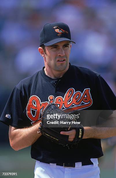 Mike Mussina of the Baltimore Orioles lines up the pitch during the Spring Training Game against the St Louis Cardinals at Fort Lauderdale Stadium in...