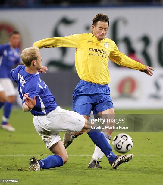 Tim Sebastian of Rostock and Ronald Maul of Jena fight for the ball during the Second Bundesliga match between Hansa Rostock and Carl Zeiss Jena at...