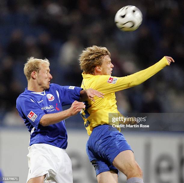 Tim Sebastian of Rostock and Sebastian Helbig of Jena compete in the air for the ball during the Second Bundesliga match between Hansa Rostock and...