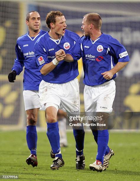 Stefan Beinlich, Marcel Schied and Rene Rydlewicz of Rostock celebrates the 1st goal during the Second Bundesliga match between Hansa Rostock and...