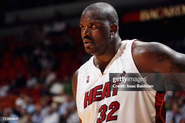Shaquille O'Neal of the Miami Heat looks on against the Houston Rockets during the preseason game at American Airlines Arena on October 25, 2006 in...
