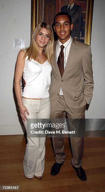 Footballer Theo Walcott and partner Melanie Slade attend the gala opening of the Exceptional Youth Exhibition hosted by Teen Vogue's editor in chief...