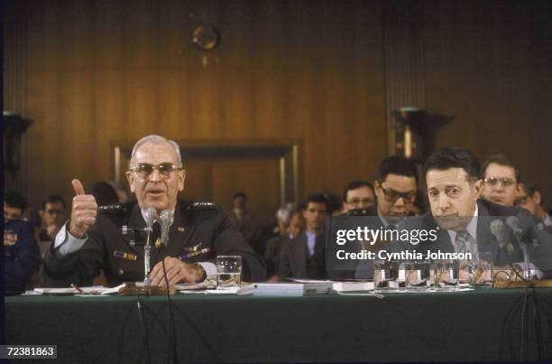 Joint Chiefs of Staff Chairman John Vessey and Secretary of Defense Cap Weinberger at Senate Armed Services Committee hearing on defense budget.