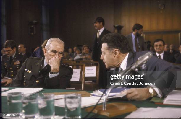 Joint Chiefs of Staff Chairman John Vessey and Secretary of Defense Cap Weinberger at Senate Armed Services Committee hearing on defense budget.