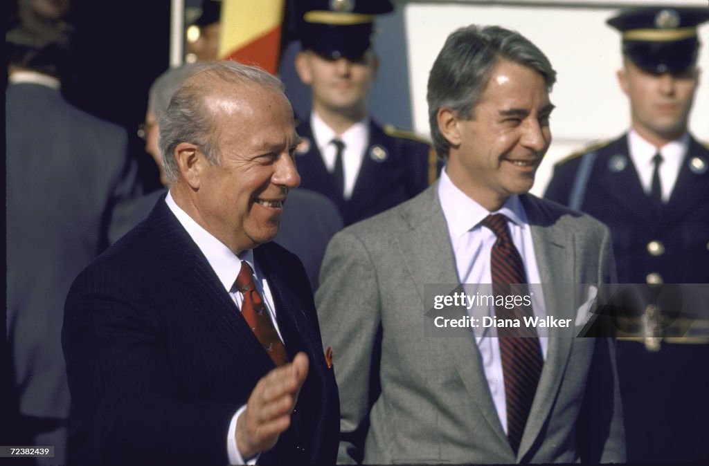 Secy of State George Shultz (L) w State Dept official Rich