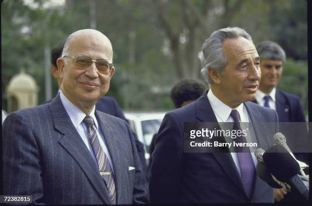 Israeli Foreign Minister Shimon Peres and Egyptian Foreign Minister Ahmed Esmat Abdel Meguid speaking during a press conference.