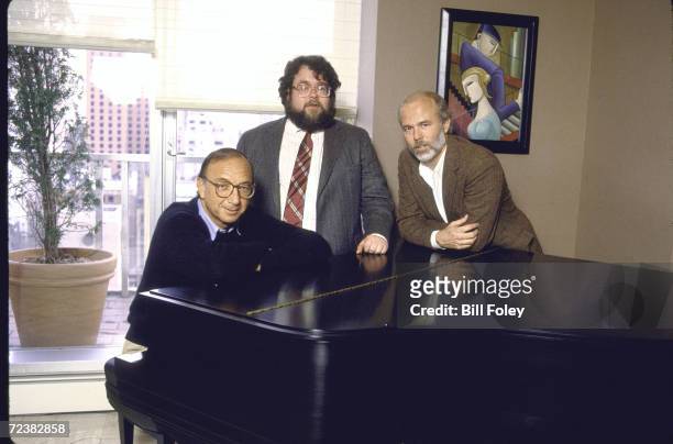 Group portrait around piano of photographer, David Hume Kennerly , playwright Neil Simon and Time theater critic William A. Henry III.
