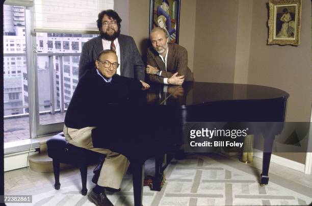 Group portrait around piano of photographer, David Hume Kennerly , playwright Neil Simon and Time theater critic William A. Henry III.