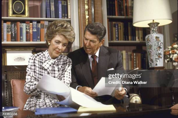 President Ronald Reagan and wife Nancy review their speech on drugs.