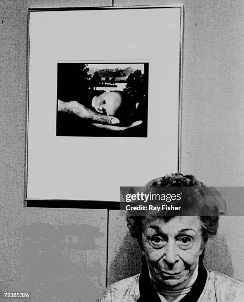 Photographer Ruth Bernhard. Her 1936 photo entitled "Creation" is on the wall behind her.